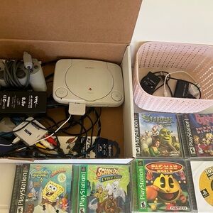 Play station slim with lots of games included